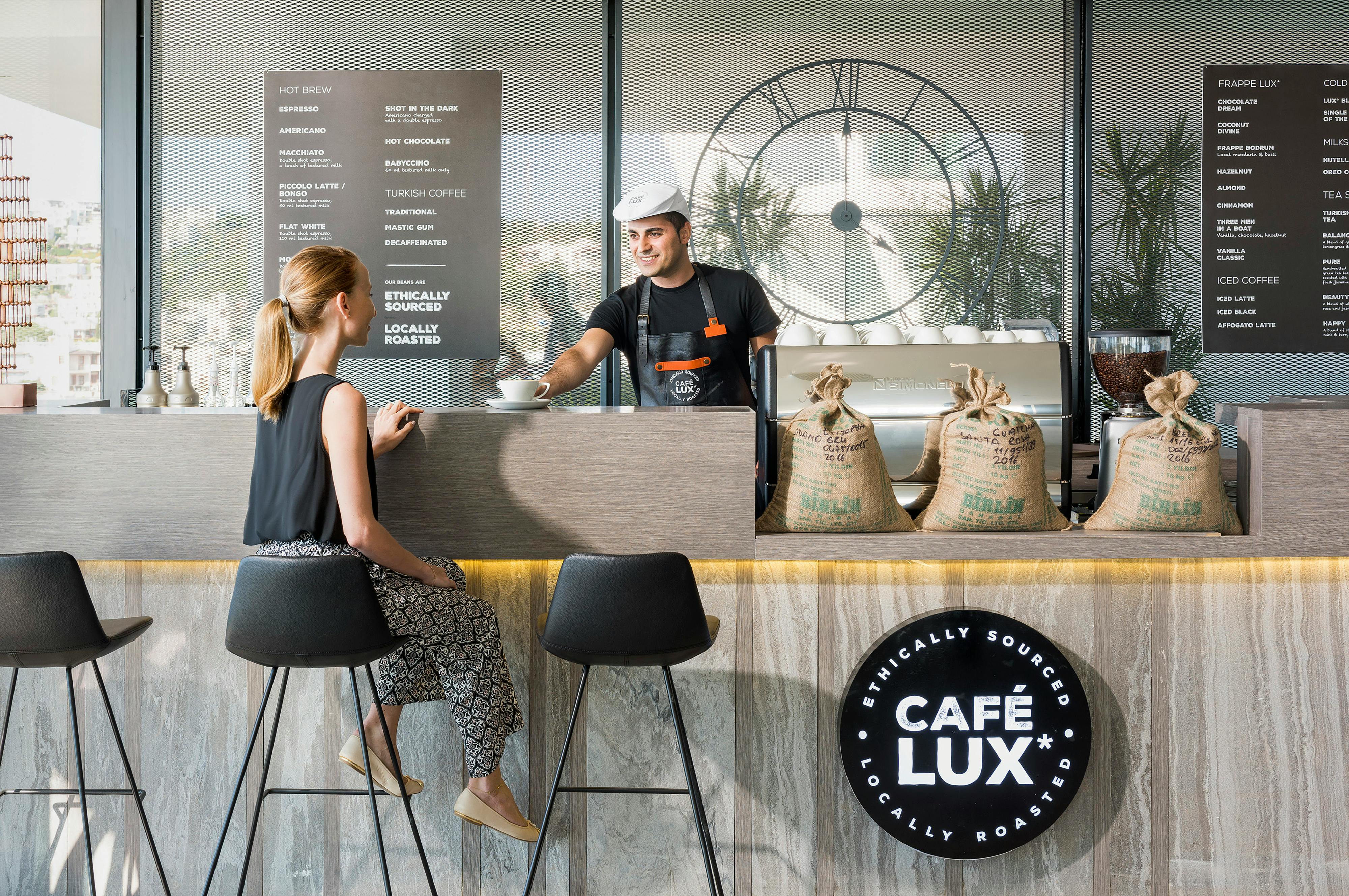 A small business owner serving a customer
